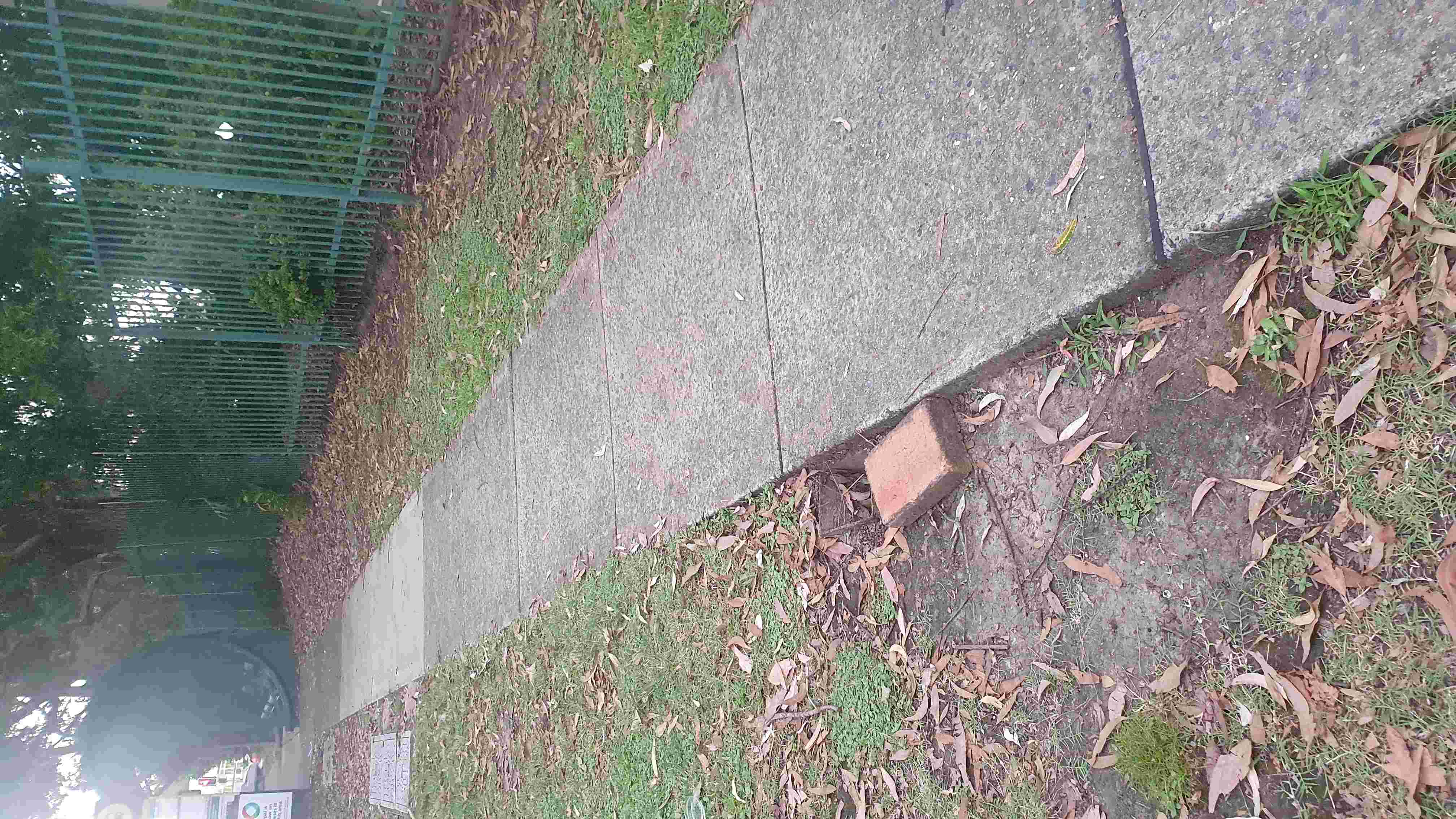SP52948-OHS-tripping-hazard-with-hole-near-pathway-in-front-of-complex-photo-2-14Feb2022.jpg