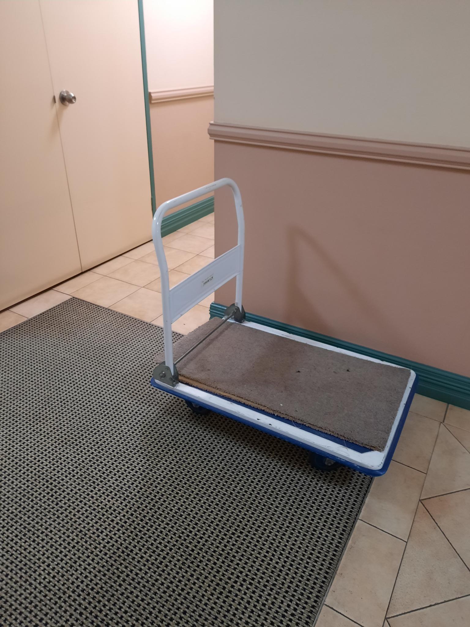 SP52948-unidentified-trolley-OHS-hazard-left-in-foyer-Block-A-level-2-1-30Jun2021