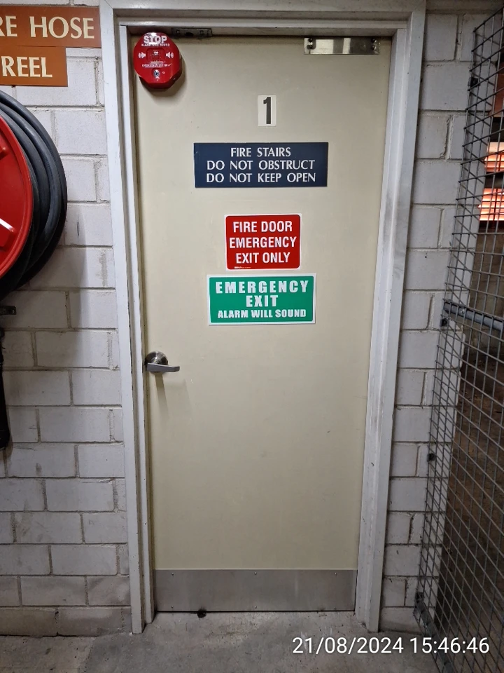 SP52948-Block-A-basement-fire-door-with-metal-plate-hiding-damages-21Aug2024