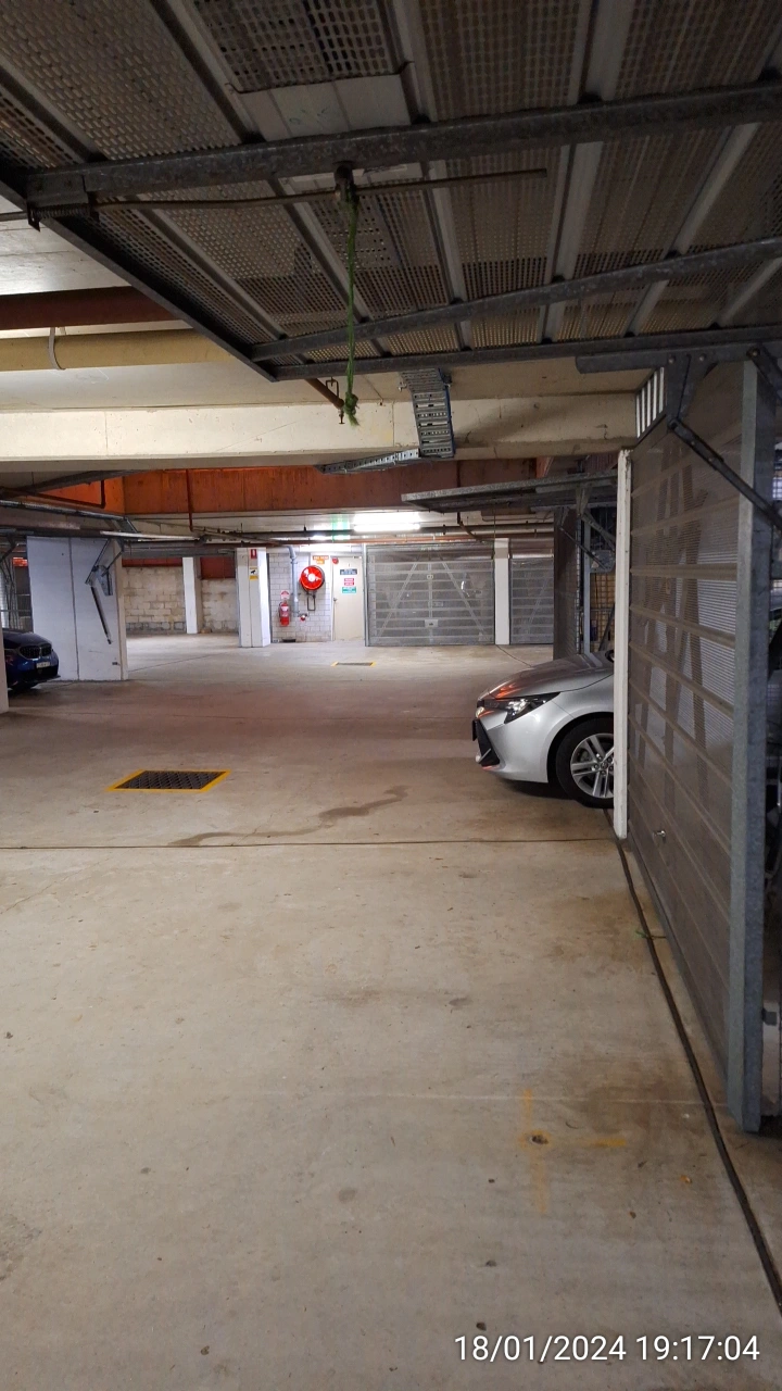 SP52948-basement-car-occupying-common-property-in-front-of-Lot-151-due-to-overloaded-garage-space-photo-1-18Jan2024.webp